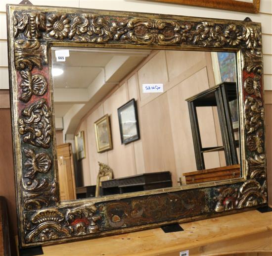 A Florentine style carved and painted giltwood painted wall mirror, 90 x 116cm